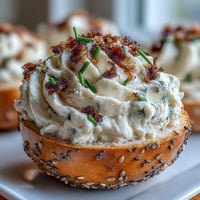 Everything bagel deviled eggs topped with creamy filling and savory seasoning.